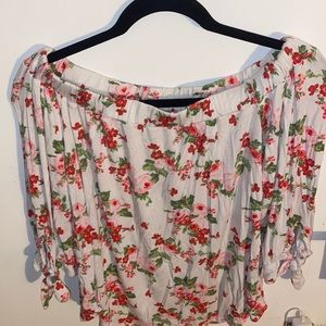 White flowery blouse, off the shoulder.